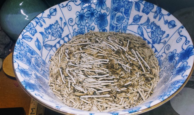 An offering bowl filled with incense.