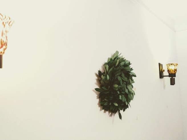 Solstice wreath, viewed from an angle with two lights in view.