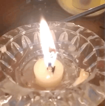 Hestia's candle flame with a large wick "bloom" on top.